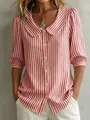 Close-up of woman wearing a red and white vertical striped blouse with a Peter Pan collar - XS / Tops / Red