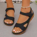 Close-up of black platform wedge sandals with peep toe and contrast stitching - Black