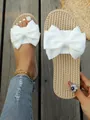Comfortable summer flat slides with white fabric bow and straw-braided texture sole - 35 / White