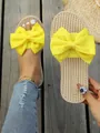 Eleganti ciabatte gialle con fiocco e comoda suola effetto paglia per l'estate. - Giallo