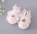 Detailed view of pink baby girl toddler shoes with delicate lace and ribbon bow - Light Pink