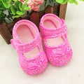Close-up of pink floral baby walker shoes with soft soles and decorative bows - Floral Pink