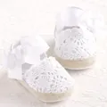 White crochet lace baby pre-walker shoes with large ribbon bows and soft soles - White