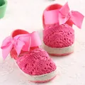 Pink hollow-out crochet baby shoes with large satin bows and soft soles for infants. - Rose Red