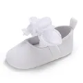 Close-up of elegant white baby princess shoe featuring a delicate fabric flower detail. - 11cm / White