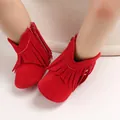 Red suede baby boots featuring stylish fringe decoration and side zipper closure - Red