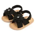 Vue détaillée de sandales noires pour bébé avec décoration florale et semelles souples - 11cm/EUR17 / Paire de Chaussures Seule / Noir