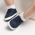 Close-up of navy blue baby walker shoes with soft non-slip soles for infant boys. - Inner Length 12cm / Blue
