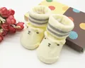 Soft yellow baby socks with cute 3D bear face and striped cuffs - 0-6 Months / Yellow