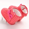 Close-up detail of pink cable-knit baby winter boots with warm white fur lining - 11cm / Red