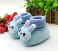 Close-up detail of soft blue plush infant booties featuring a cute 3D bunny cartoon character - Size 12/11CM / Big Eye Rabbit-Blue