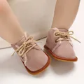 Close-up of pink baby walking boots with soft faux fur lining and gum rubber sole - Gray Red