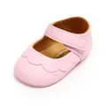 Close-up view of pink PU leather baby walking shoe featuring scalloped edges and velcro strap - Princess Shoes / 11cm / Pink