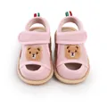 Close-up of pink mesh baby sandals featuring a cute embroidered cartoon bear patch - 11cm / Pink