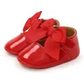 Close-up of red patent leather baby princess shoes with large ribbon bow detail. - 12cm / Princess Shoes (M1978) / Red