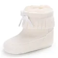 Close-up detail of white infant winter snow boots with soft fleece lining and fringe - 11cm / White