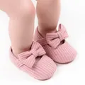 Detailed view of pink knitted baby girl Mary Jane shoes featuring a soft bow ornament - 12cm / Bow Style / Pink