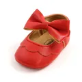 Detailed view of the red PU leather baby shoe with a large bow ornament - 11cm / Red