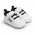 Detail view of premium white leather baby boy walker shoes with navy blue laces - 11cm / White