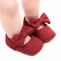 Close-up of ribbed knit texture and elegant bow on dark red infant princess walking shoes. - 12cm / Bow Style / Red