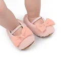 Close-up of pink fuzzy baby pre-walker shoes with soft bow and elastic strap - Insole Length 11cm / Pink
