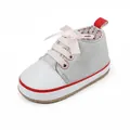 Close-up of grey baby girl walking shoe with pink ribbon laces and white toe cap - Inner Length 12cm / Gray