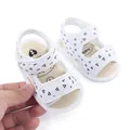 Close-up view of white baby summer sandals with triangle print and soft anti-slip fabric sole - 13cm / White