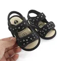 Close-up of black baby walking sandals with white triangle patterns and soft soles - 13cm / Black