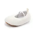 Close-up of a white fuzzy baby walking shoe with a soft elastic strap and brown sole. - Inner Length 12cm / White