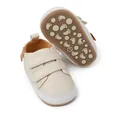 Close-up of cream baby walking shoes with velcro straps and anti-slip footprint sole - 11cm / Casual Style (2150) / Beige