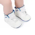 Side view of white baby basketball shoes with blue trim and elastic laces. - 12cm / White Blue