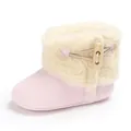 Detail view of pink baby winter snow boots with soft fleece lining and wooden toggle button. - Pink