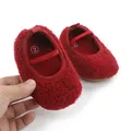 Detailed view of red fuzzy baby walking shoes featuring an elastic strap and soft textured fabric - 11cm / Red