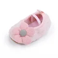 Detail of soft pink fuzzy baby shoe with decorative knit flower and elastic strap - Pink