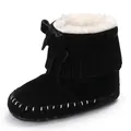 Detailed view of black tassel baby boots featuring soft faux fur lining and decorative bow - 11cm / Black