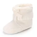 Close-up of cream white baby tassel boot featuring soft faux fur lining and cute bow detail - 11cm / White