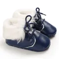 Detail shot of navy blue infant boots with soft soles and thick white faux fur trim - Dark Blue