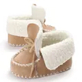 Detail view of warm infant winter boots with soft fleece lining and camel suede finish. - Apricot