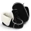 Detail of winter warm baby walking shoes with soft fleece lining and hand-stitched sole - Black