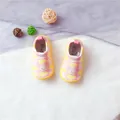 Macro view of pink children's elastic slip-on shoes featuring a cute cloud pattern - Pink Cloud