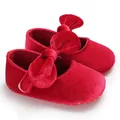 Close-up of elegant red velvet baby princess walker shoes with large bow detailing - 12cm / 37.00g / Red