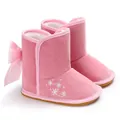 Close-up detail of pink baby snow boots featuring a cute satin bow and snowflake embroidery - 12cm / Pink