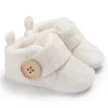 Detailed view of soft white plush winter baby shoes with decorative button - 11cm / White