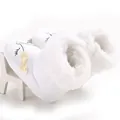 Detail view of white baby winter snow boots with soft faux fur lining and yellow bow - 11cm / White