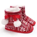 Close-up of red and white knitted Christmas baby boots with warm fur lining - Inner Length 11cm / Nordic Red and White Knit Style (C-402)