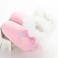 Warm pink winter baby snow boots featuring white faux fur trim and shiny bow detail - Pink