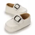 Close-up of white soft-soled baby loafers with metal buckle detail - White