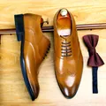 Handcrafted tan leather brogue dress shoes for men with elegant wingtip details - 37 / Brown