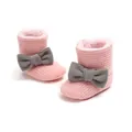 Detail view of pink ribbed winter baby snow boots featuring grey bows and plush lining - Pink + Grey