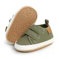 Detailed view of olive green baby walking shoes showing sole pattern and velcro straps - 12cm / Green